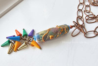 One of a kind artisan necklace features colorful lampwork and a colorful fringe