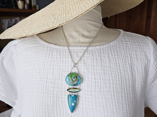 Aqua blue artisan jewelry on model