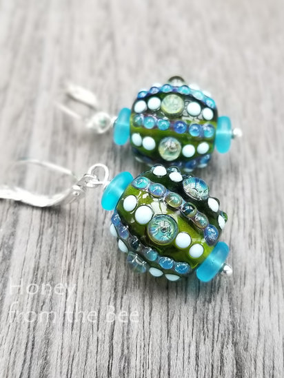 Asea earrings features lampwork