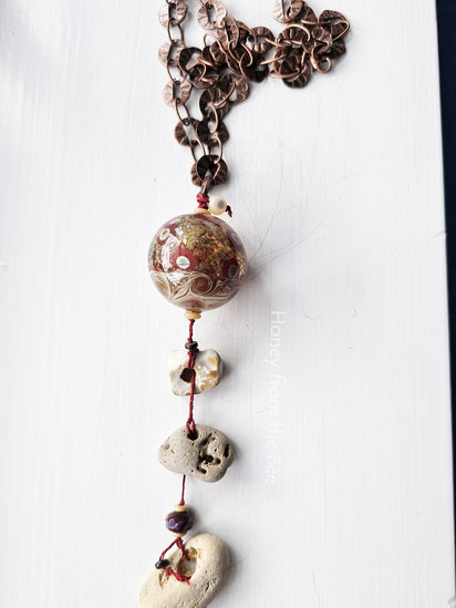 Hope Floats No 3 pendant features hag stones, lampwork