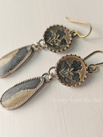 Mended earrings feature antique buttons and Maligno Jasper