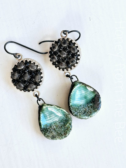 Niagara earrings features antique black glass buttons and ceramic drops