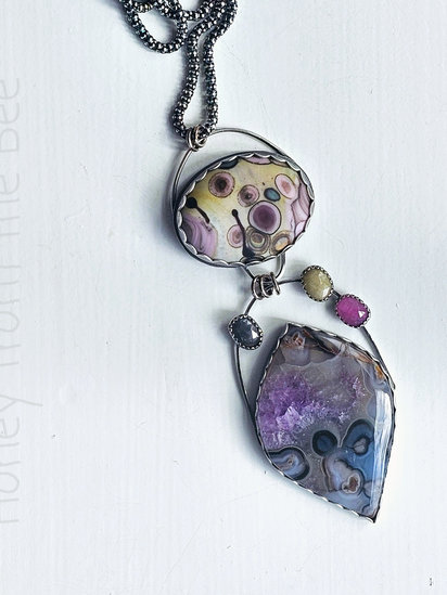 Yellowstone pendant features Pseudomorph agate, sapphires, lampwork and sterling silver