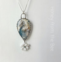 Blue and white gemstone pendant