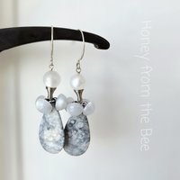 Grey and white earrings feature vintage buttons and orbicular jasper