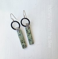 Long dangle earrings feature turquoise and sterling silver