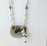 One of a kind necklace features butterfly and Polish Flint
