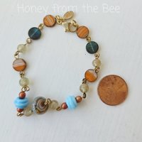 Beaded bracelet in blues and oranges