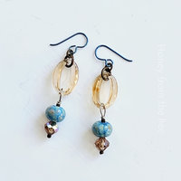 Artisan earrings feature lampwork and crystals in sky blue and champagne