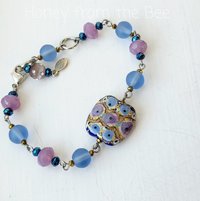 Blue and pink bracelet features lampwork focal with gold foil