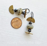 Modern earrings in cream and gold