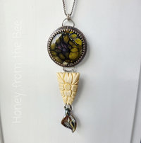 Antique buckle pendant in flower theme