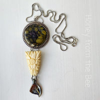 Garden necklace with flowers and butterfly wing