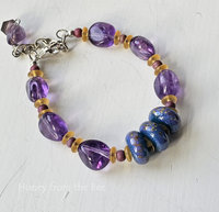 Amethyst bracelet with lampwork in shades of teal, purple and yellow