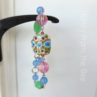 Colorful bead bracelet features lampwork bead with gold foil