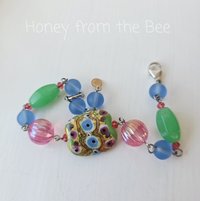Artisan bead bracelet in blue, pink and green