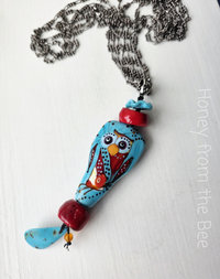 Lampwork necklace features owl in red and turquoise