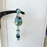Artisan bracelet in aqua and cream and black