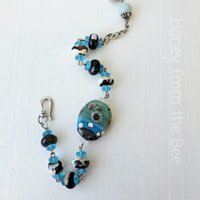Beach bracelet in aqua, black and cream