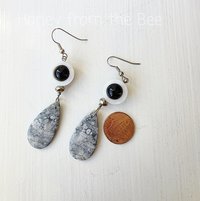 Dangle earrings in grey and white with pop of black