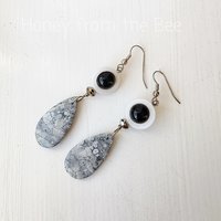 Grey and white earrings with pop of black