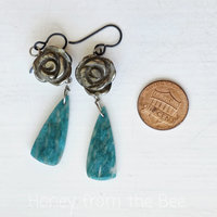 Silver rose earrings with green gemstone dangle