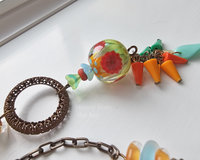 Exquisite lampwork focal in this bright and fun necklace