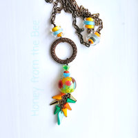 Tunic length necklace in an explosion of color