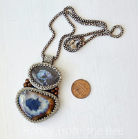 Bead embroidered pendant features boulder opal, pearls and ceramic
