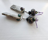 Statement earrings feature sapling jasper and raku lampwork