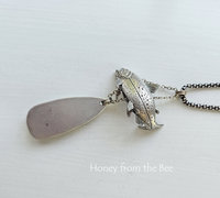 Photo shows back of sterling silver pendant