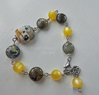 Grey and yellow beaded bracelet