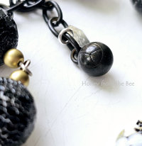 Peace symbol charm on honeybee bracelet