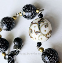 Statement bracelet in black and white with honeybee focal