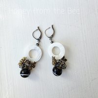 Party earrings feature antique buttons, mother of pearl and crystal