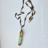 Nature inspired pendant features chrysophase and brass