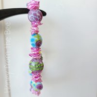 Keshi pearl bracelet in pink and blue and green features lampwork
