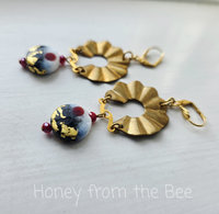 Artisan earrings in gold and red