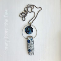 Outer space inspired pendant in blue and silver