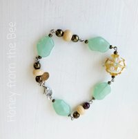 Yellow and green beaded bracelet with lampwork focal