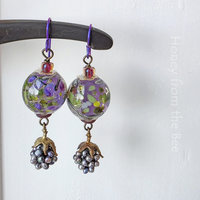 Summer earrings feature berry dangle and lampwork in purple and green