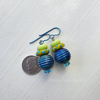 Summer earrings feature lampwork in shades of the sea in the sunshine