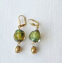 Bright green and gold earrings feature lampwork and a vermeil dangle
