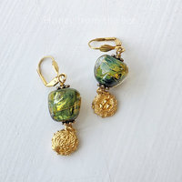 Lampwork earrings in green and gold with bird's nest dangle