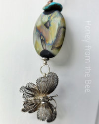 Butterfly theme necklace in peach and turquoise