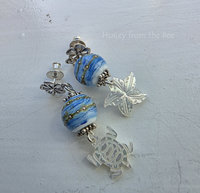 Sterling silver post earrings with blue and white lampwork