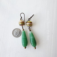 Statement earrings in green and gold