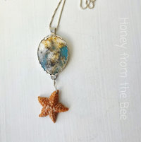 Starfish pendant with plume agate set in sterling silver