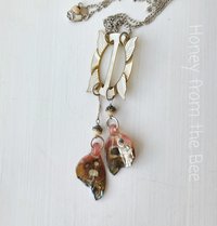 Boho style necklace with antique mother of pearl focal and butterfly wings in artisan glass