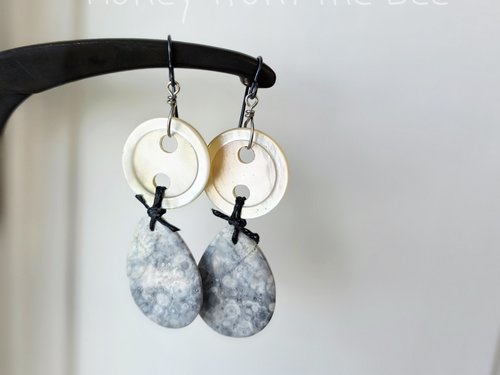 Grey and white earrings feature antique mother of pearl buttons and orbicular jasper
